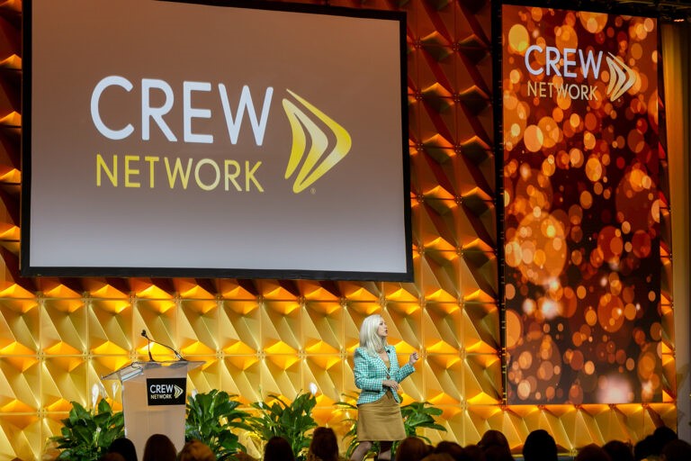 CREW Network individual female speaker on stage